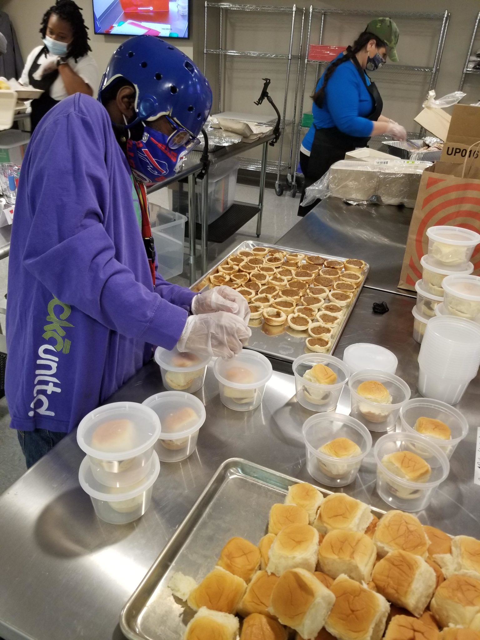 A person we support works on packaging a meal kit in our culinary prep classroom