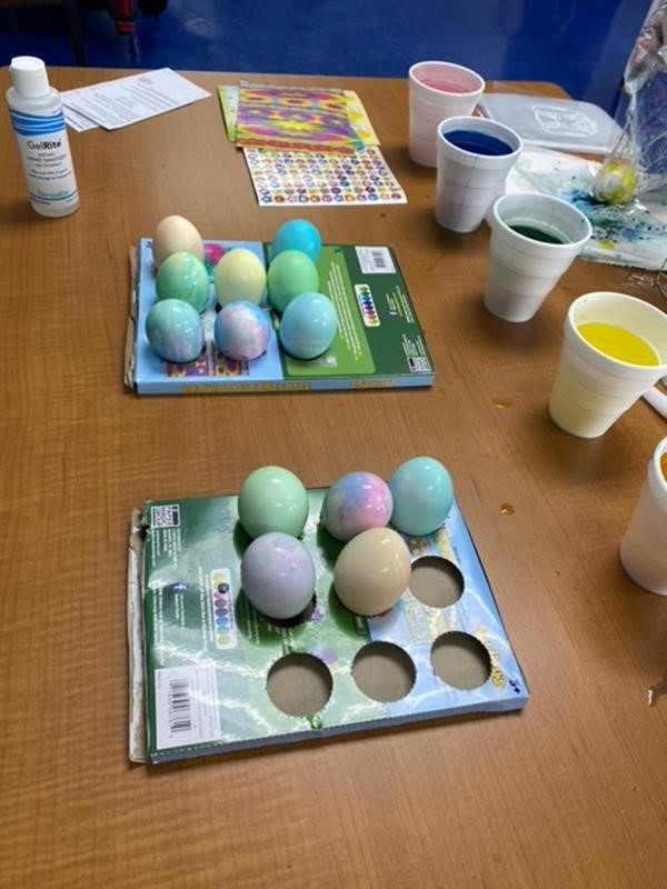 Dyed eggs for Easter are drying on racks