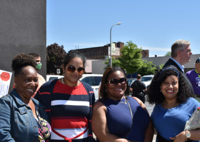 Photo of four women smiling